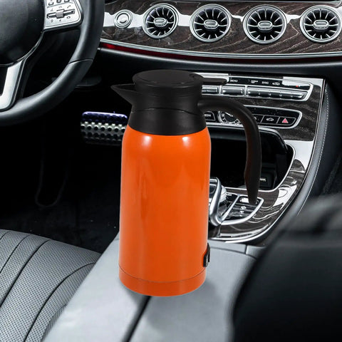 Road Ready Portable Car Electric Kettle Water Heater With Roomy 1000 Ml Stainless Steel Build in orange color, placed in a car.