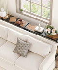 Smooth Vibes Two Tier Industrial Console Table With Open Storage Shelves For Tight Hallways Rustic Wood Surface Heavy Steel Legs Built Damn Tough No Hassle Setup Living Room Corner Unit above a couch with decorative items.