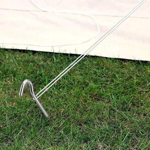 Heavy Duty 9 Inch Metal Tent Stake securing a garden canopy on grass