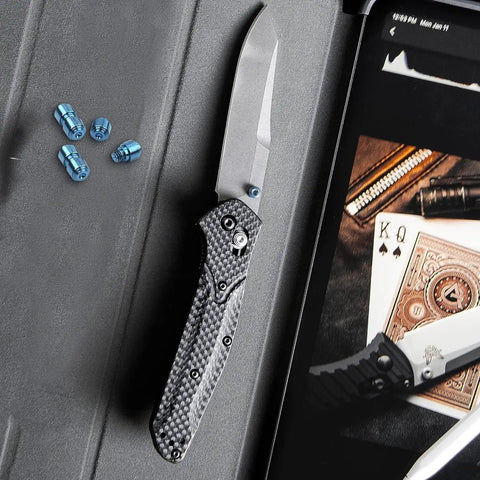 Level Up Your EDC Game With This Badass Deep Carry Pocket Clip And Titanium Pivot Screws Thumb Studs Upgrade Kit For Benchmade 535 Bailout Custom Blue Mod, showing knife and blue titanium screws.