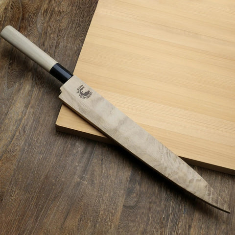 Yanagi knife with Premium Magnetic Oak Saya Cover for safe transport and storage, 270mm rugged blade protector on wooden surface.