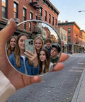 Handheld Convex Mirror Set Portable Shatter Resistant Lens Create Wide Angle Photos with group of six friends in a city street.
