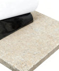 Heavy Duty Three Pack 6x24 Inch Non Slip Stair Treads With Black High Traction Adhesive Tape being applied to stone surface