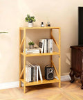 Rustic Bamboo 3 Tier Bookshelf Narrow Storage Rack For Living Room Office Kitchen Garage And Bedroom Super Handy Space Saving Multifunctional Shelf Organizer For Books Plants Decor 42 X 30 X 80 Cm shown in a cozy living room setting with books and plants.