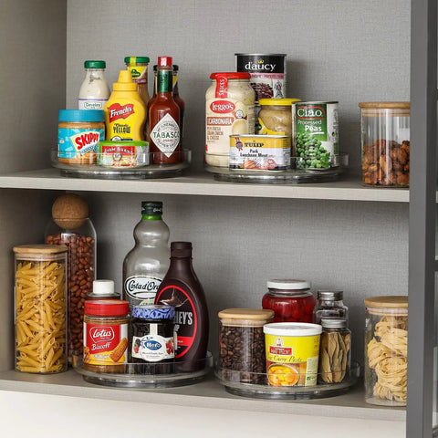 Four Pack 9 Inch Clear Acrylic Lazy Susans Non Skid Turntables Organizer For Cabinets showing pantry items organized.