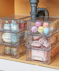Four stackable clear storage drawers, 12x7.5x4.4 inches, with removable dividers in bathroom organizer for tools and supplies.