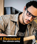 Man wearing Anti Fog Safety Glasses With Side Shields And ANSI Z87.1 Eye Protection while using a hammer indoors.