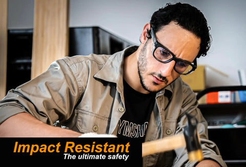 Man wearing Anti Fog Safety Glasses With Side Shields And ANSI Z87.1 Eye Protection while using a hammer indoors.