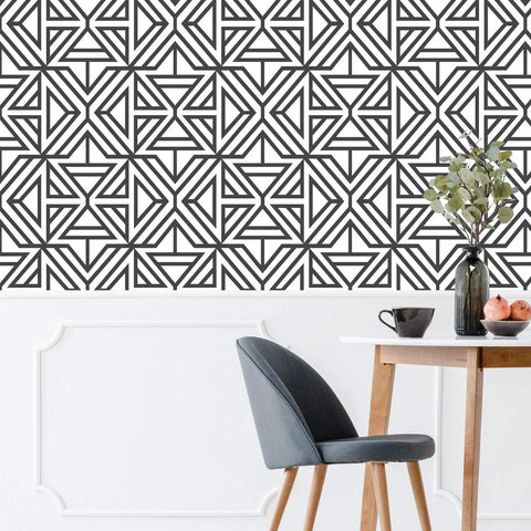 Room with black and white geometric wallpaper, peel and stick, safe for walls, removable without residue, modern linear pattern.