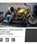 Man working on motorcycle using Garage Floor Mat For Oil Spills 29 By 36 Inches Reusable And Washable Oil Absorbent Pad