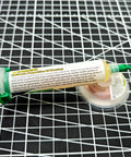 No Clean Soldering Flux Paste And Desoldering Wick Kit with flux tube and braided copper wick on grid surface