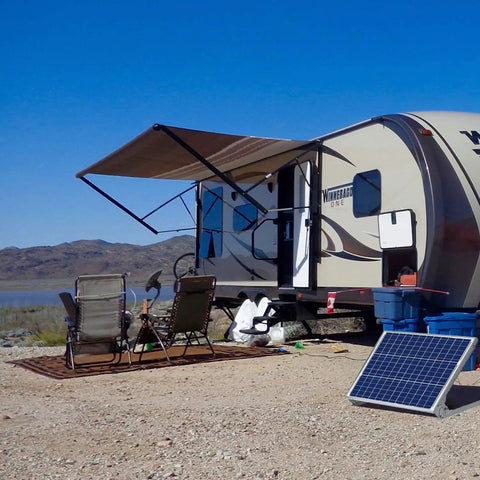12V 50W Solar Battery Charger And Maintainer With Ultra Smart MPPT Controller by a camper on a sunny day, adjustable mount bracket