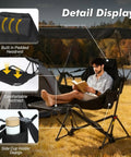 Man relaxing on Portable Folding Hammock Camping Chair With Canopy And Footrest by a lake