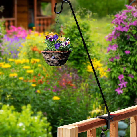 Hella Durable Expandable Deck Hook With A Two Inch Non Slip Railing Mount holding a flower basket in a colorful garden.