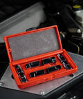 8 Piece Stud Extractor Set For SAE And Metric, Broken Stud Removal Sockets displayed in red case on automotive engine