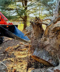 Stump Bucket For Tractors And Skid Steers Up To 105 HP With Bi Directional Ripping Edge removing large tree stump in forest