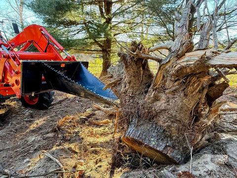 Stump Bucket For Tractors And Skid Steers Up To 105 HP With Bi Directional Ripping Edge removing large tree stump in forest