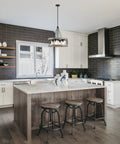 Hayden 25 Inch 4 Light Modern Farmhouse Drum Pendant Light With Cylinder Glass Shades in Gray Oak Finish hanging in kitchen