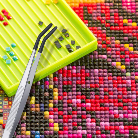 4 Piece Rubber Coated Tweezers Set With Straight Point Flat Tip And Long Bent Tips For Crafts Beads Stamps Jewelry Making DIY Projects Snag Free Grip And Delicate Tweezers For Fine Pickups in use with multicolored craft beads and green tray