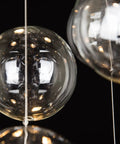 Close-up of glass elements from Five-Light Modern Crystal Chandelier With Spiral Raindrop Style Pendant Light Flush Mount Ceiling Fixture