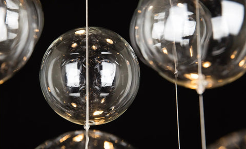Close-up of glass elements from Five-Light Modern Crystal Chandelier With Spiral Raindrop Style Pendant Light Flush Mount Ceiling Fixture