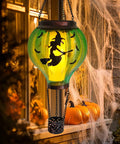 Halloween Outdoor Decoration Hot Air Balloon Solar Lantern with flickering flame and witch design on a porch.