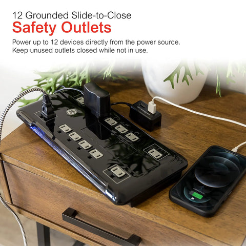 Turn One Outlet Into Twelve With Tethered USB Ports Surge Protector, 8 Ft Cord, Flat Plug, 4320 Joules, Power Filter, Circuit Breaker, UL Listed, Black, Extra Wide Spaced Outlets, Warranty Included on wooden table with devices plugged in