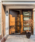 Capulet Amber Glass Center Column Outdoor Indoor Wall Sconce With LED Black Finish on modern porch entryway