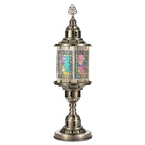 Multi Color Carved Glass Hexagonal Table Lamp With Stained Mosaic Glass And Retro Metal Frame shining in a boho style design.