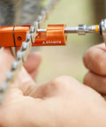 Stash Bike Chain Tool Kit With Hidden Handlebar Storage For Quick On The Go Repairs being used to fix a bicycle chain close-up
