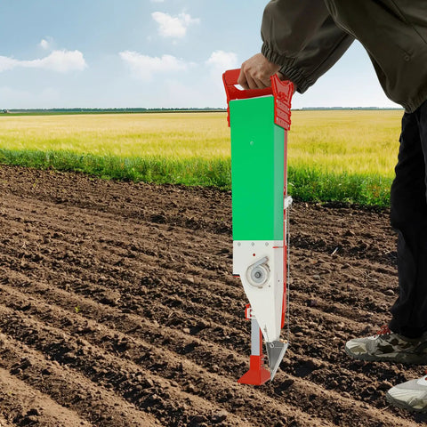 Adjustable Manual Seeder Handheld Sowing Tool For Fast Precise Seed Distribution In The Garden Row Planter For Peanuts Corn Beans Portable Seed Dispenser Easy Grip Stand Up Sowing No Bending Required in use in a field