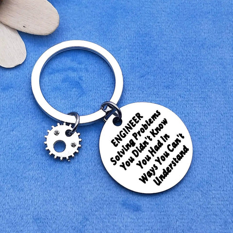 Engineer Solving Problems You Didnt Know You Had Keychain Gift For Engineering Students with gear charm on blue background