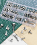 Pro Grade 50 Piece 304 Stainless Steel T Slot Bolt Kit M5 And M6 Drop In Stud Bolts organized in a plastic case on a cutting mat