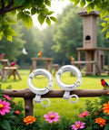 2 Pack Silver Parrot Foot Rings For Small To Medium Birds, durable metal leg bands with opening clip in a garden setting