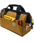 Trade Series 16 Inch Tool Bag With Zippered Main Compartment 23 Pockets Metal Frame, tools visible in exterior pockets