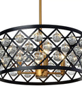 Matte black chandelier with gold accent and crystal balls, showcasing classic elegance for home decor.