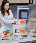 Heavy Duty Chamber Vacuum Sealer Boasts A Snappy 260 Watt Motor Generating Serious Suction To Handle Wet Grub Meats And Sauces Like A Boss While Keeping Your Kitchen Stock Fresh Inside A Compact Design Setup with salmon being sealed.