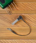Heavy Duty Stainless Steel Quick Release Push Button Ball Locking Pin 10mm By 30mm For Audio Speaker Mounting Industrial Fastener With Easy Grab Handle on wooden surface.