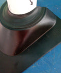 Close-up of black base of Two Piece Retrofit Pipe Flashing Kit Black For Roofs You Can’t Flash Over, Seals Around Pipes And Vents, Easy Install, Weatherproof Roofing Flashing For Leak Prevention And Durable Exterior Protection