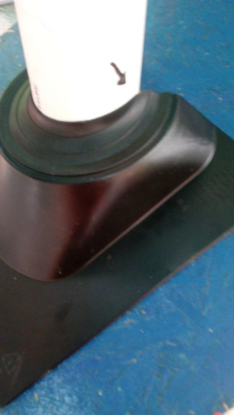 Close-up of black base of Two Piece Retrofit Pipe Flashing Kit Black For Roofs You Can’t Flash Over, Seals Around Pipes And Vents, Easy Install, Weatherproof Roofing Flashing For Leak Prevention And Durable Exterior Protection