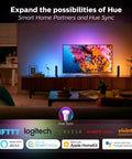 Living room with A19 smart bulb showcasing vibrant colors on a TV and walls, highlighting compatibility with various smart home systems.