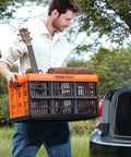 Person lifting Collapsible 45L Storage Crates Set of 3 With Handles, Go To Stackable Bins for tools at a car trunk