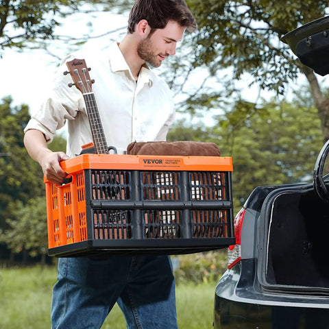 Person lifting Collapsible 45L Storage Crates Set of 3 With Handles, Go To Stackable Bins for tools at a car trunk