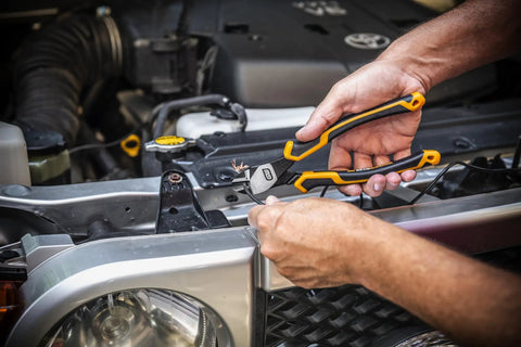 Pitbull Cushion Grip Pliers Set With Foam Storage Tray, K9 Jaw Grip being used to cut wire in automotive repair