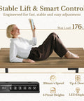 Woman adjusting the 70 Inch L Shaped Electric Standing Desk With Heavy Duty Steel Frame And Smooth As Silk Height Adjustments.