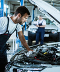 Mechanic inspecting car with GM 4L80E Transmission Internal Wire Harness With Temp Sensor For 1994 1995 1996 1997 1998 1999 2000 2001 2002 2003 Models