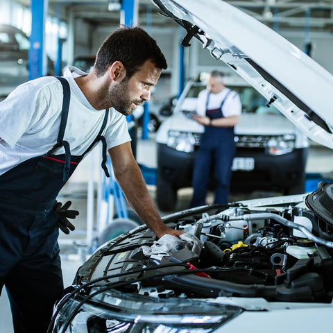 Mechanic inspecting car with GM 4L80E Transmission Internal Wire Harness With Temp Sensor For 1994 1995 1996 1997 1998 1999 2000 2001 2002 2003 Models