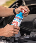 Hands pouring Pour N Go Head Gasket Sealer 16 Ounce Easy Do It Yourself Formula That Permanently Seals Engine Leaks No Tools Needed For Quick Long Lasting Car Maintenance into engine
