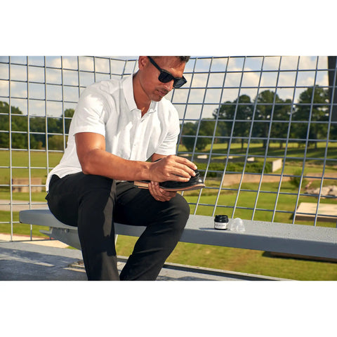 Man applying Black Leather Shoe Creme That Polishes And Protects Smooth Leather Keeps Your Kicks Looking Fresh And Shiny For Everyday Wear