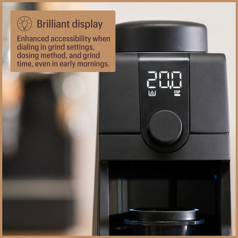 Pro Tier Stepless Grind Adjustment Coffee Grinder Featuring Precision Steel Burrs And Quick Release Design For Smooth Shot Pulling Or Effortless Daily Brewing In Slick Black Finish with a clear display panel for grind settings.
